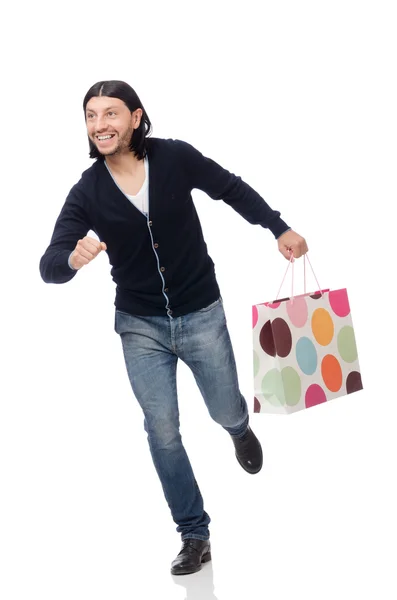 Jongeman met plastic zakken geïsoleerd op wit — Stockfoto