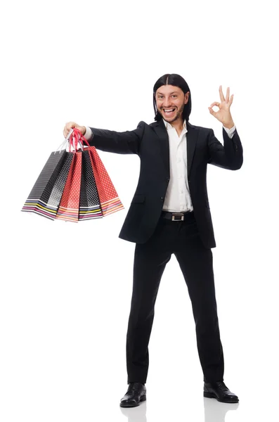 Traje negro hombre sosteniendo bolsas de plástico aisladas en blanco — Foto de Stock