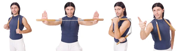 Combattente karate divertente con nunchaku su bianco — Foto Stock