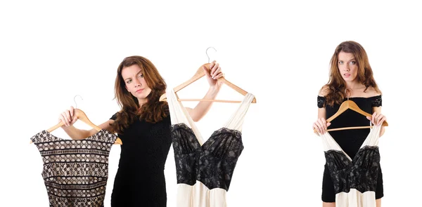 Mujer joven probando ropa nueva en blanco — Foto de Stock