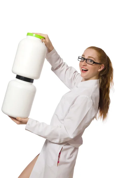 Young female doctor holding jar of protein isolated on white — Stock Photo, Image