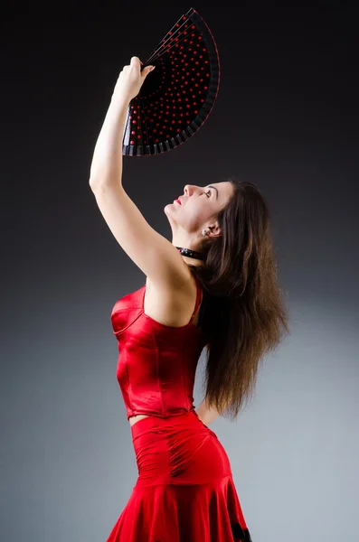 Woman with fan dancing dances — Stock Photo, Image