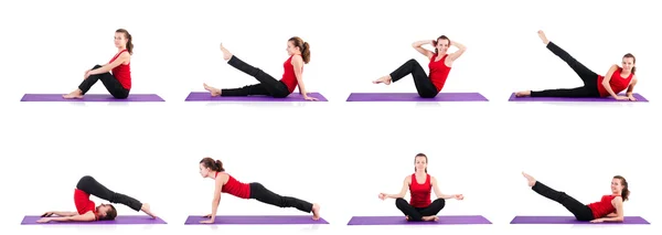 Young female doing exercises on white — Stock Photo, Image