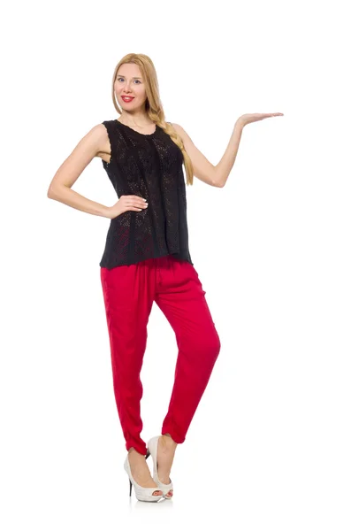 Tall young woman in red pants isolated on white — Stock Photo, Image