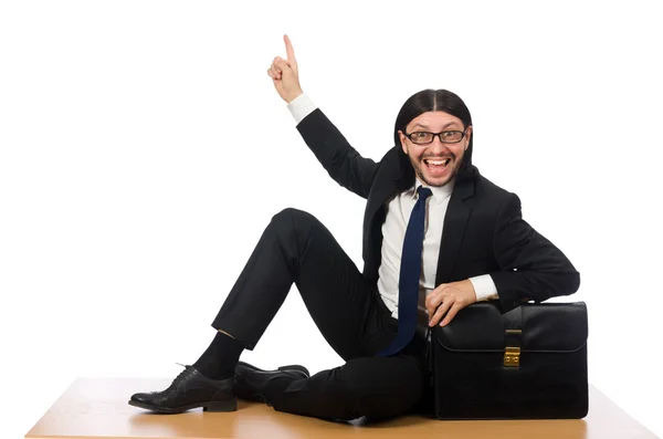 Jovem empresário sentado no chão isolado em branco — Fotografia de Stock