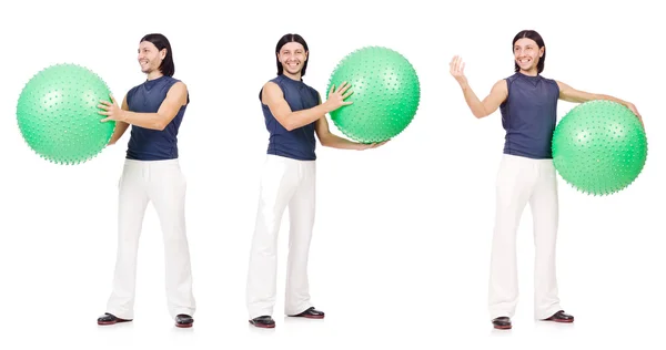 Hombre con bola suiza aislado en blanco —  Fotos de Stock