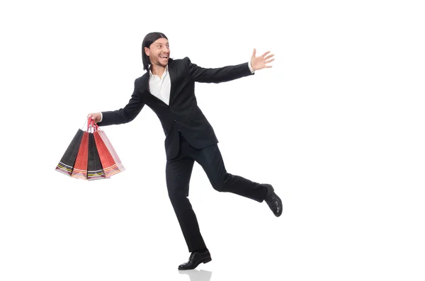 Traje negro hombre sosteniendo bolsas de plástico aisladas en blanco —  Fotos de Stock