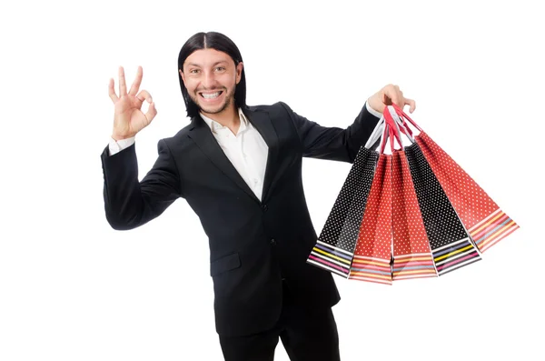Black suit man holding plastic bags isolated on white — Stock Photo, Image