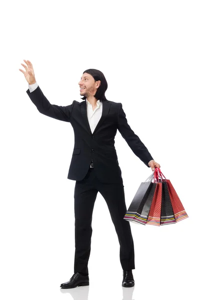 Traje negro hombre sosteniendo bolsas de plástico aisladas en blanco — Foto de Stock