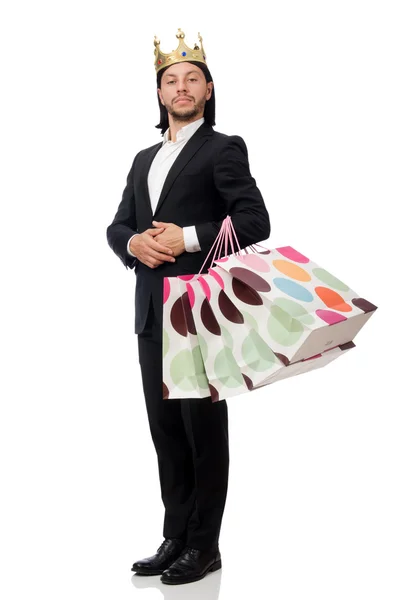 Černý oblek muž drží plastové tašky izolované na bílém — Stock fotografie