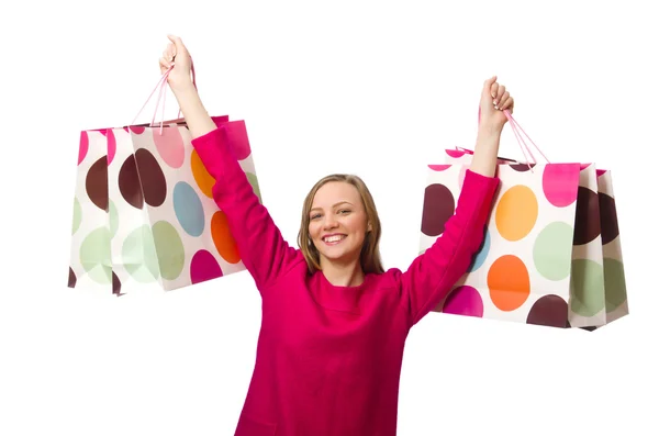 Shopper chica en vestido rosa sosteniendo bolsas de plástico — Foto de Stock