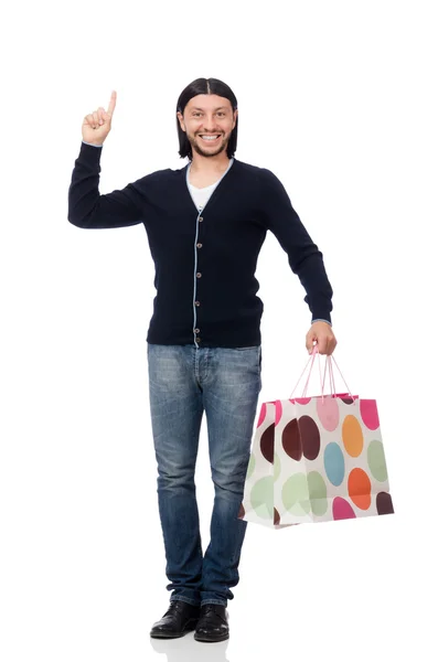 Joven sosteniendo bolsas de plástico aisladas en blanco — Foto de Stock