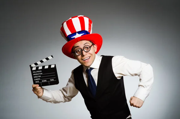 Man med amerikansk hatt och film board — Stockfoto