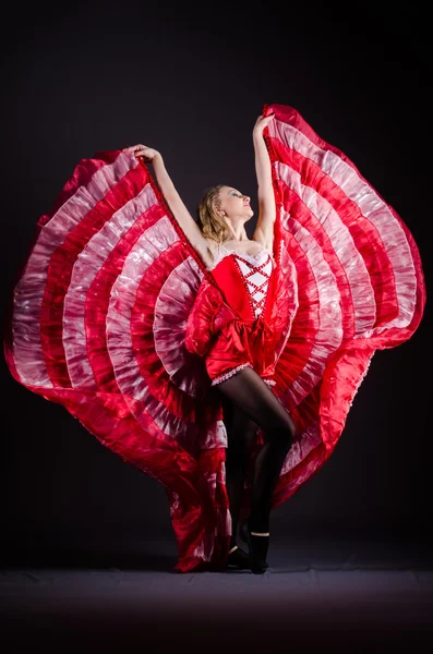 Young woman dancing in red dress — Stock Photo, Image