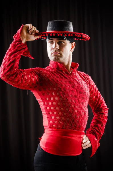 Man dancing spanish dance in red clothing — Stock Photo, Image