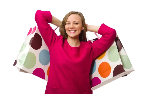 Shopper flicka i rosa klänning holding plastpåsar — Stockfoto