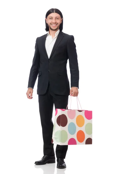 Traje negro hombre sosteniendo bolsas de plástico aisladas en blanco —  Fotos de Stock