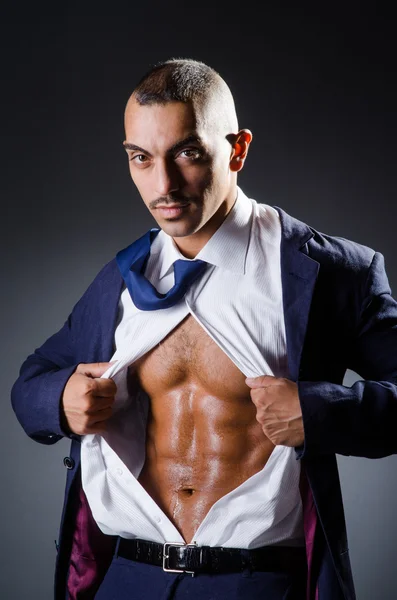 Ripped young man in studio concept — Stock Photo, Image