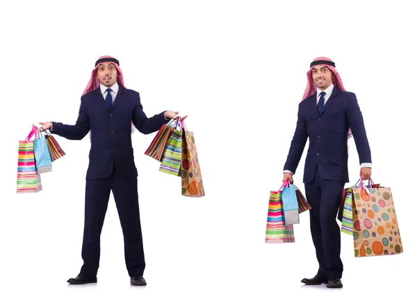 Beyaz üzerinde alışveriş hediyeleri olan bir Arap. — Stok fotoğraf