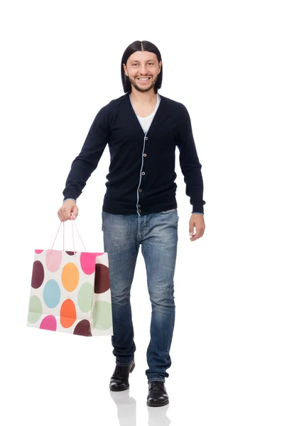 Joven sosteniendo bolsas de plástico aisladas en blanco — Foto de Stock