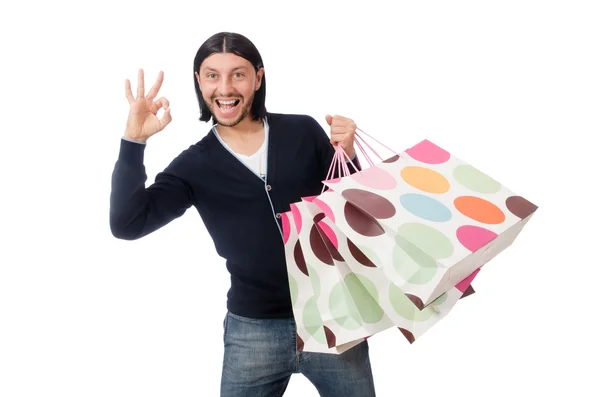 Joven sosteniendo bolsas de plástico aisladas en blanco —  Fotos de Stock