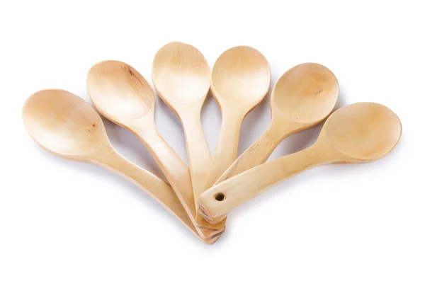 Molti cucchiai di legno isolati su bianco — Foto Stock