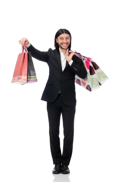 Preto terno homem segurando sacos de plástico isolado no branco — Fotografia de Stock