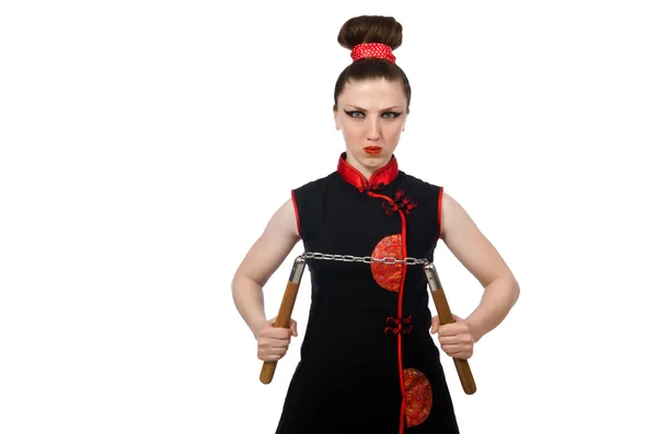 Mujer divertida con nunchucks aislados en blanco — Foto de Stock