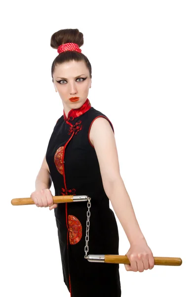 Donna divertente con nunchaku isolati su bianco — Foto Stock