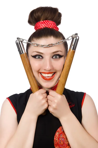 Donna divertente con nunchaku isolati su bianco — Foto Stock