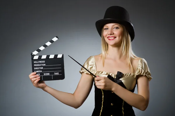 Funny woman in dark studio — Stock Photo, Image