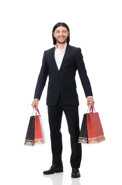 Black suit man holding plastic bags isolated on white — Stock Photo, Image