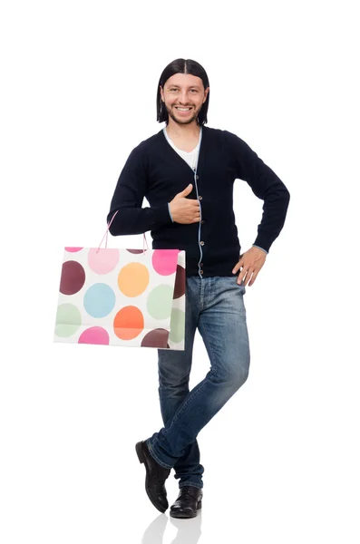 Joven sosteniendo bolsas de plástico aisladas en blanco —  Fotos de Stock