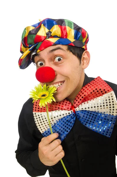 Grappige clown met bloemen geïsoleerd op wit — Stockfoto