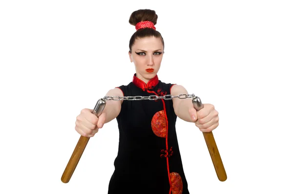 Donna divertente con nunchaku isolati su bianco — Foto Stock