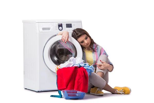 Woman tired after doing laundry isolated on white — Stock Photo, Image