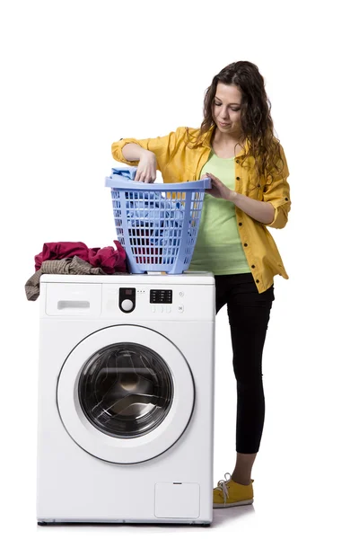 Young woman doing dirty laundry isolated on white — Stock Photo, Image