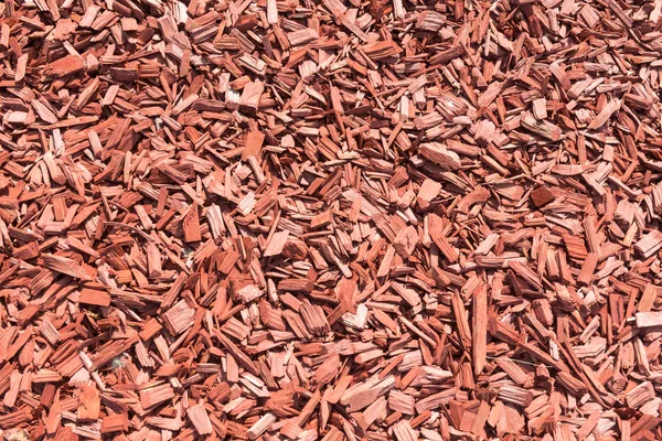 Fundo feito de lascas de madeira marrom — Fotografia de Stock