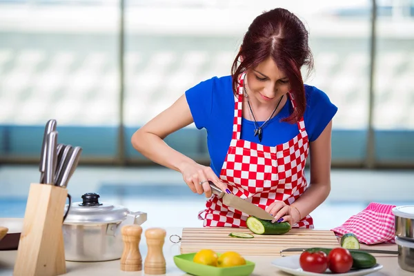 Young cook working in the kitchen — Stock Photo, Image