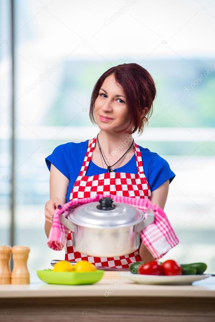 Young cook working in the kitchen