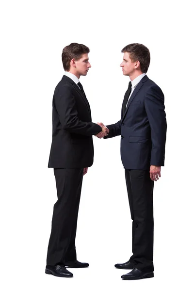 Dois irmãos gêmeos handshaking isolado no branco — Fotografia de Stock