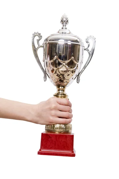 Mão segurando troféu copo isolado no branco — Fotografia de Stock