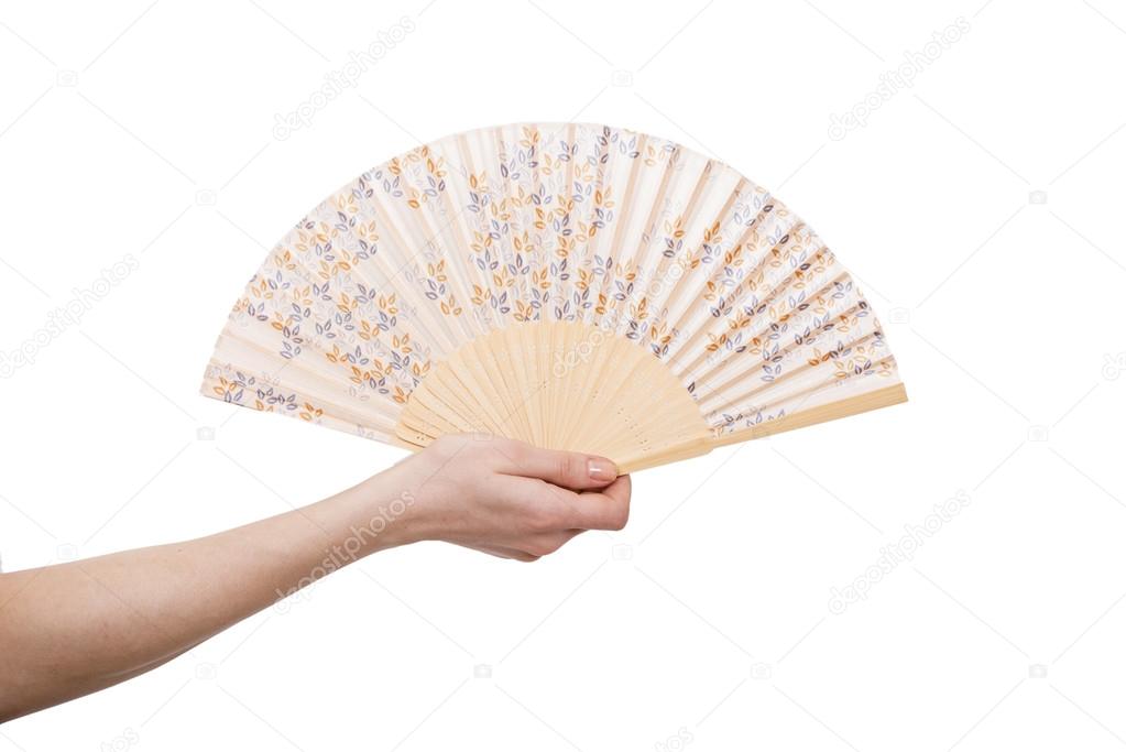 Hand holding fan isolated on white background