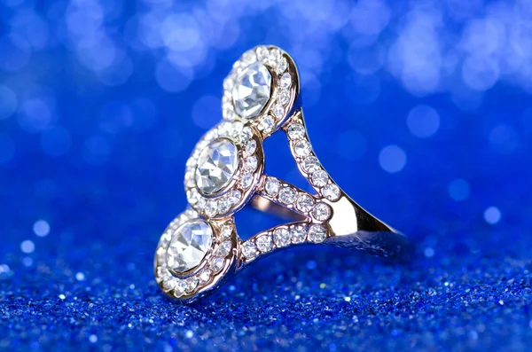 Jewellery ring against blue background — Stock Photo, Image