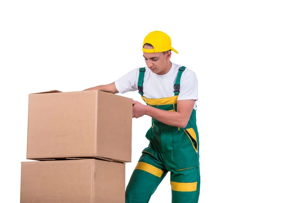 Hombre joven moviendo cajas con carro aislado en blanco — Foto de Stock