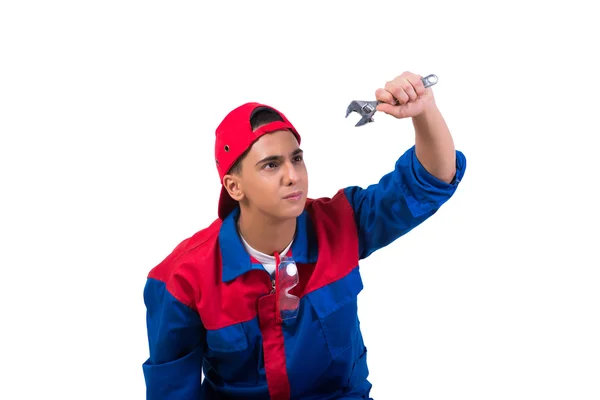 Young repairman with wrench spanner isolated on white — Stock Photo, Image