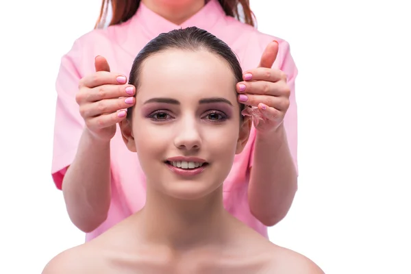 Beautiful young woman during face massage session — Stock Photo, Image