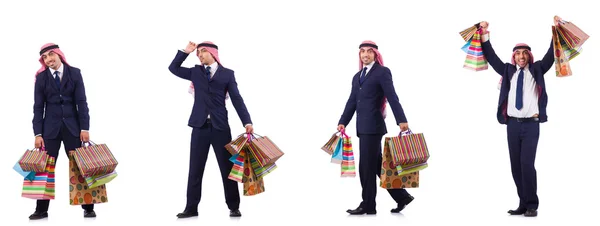 Homme arabe avec des cadeaux shopping sur blanc — Photo