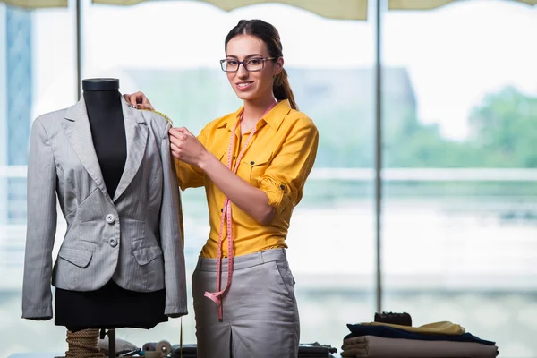 Woman tailor working on new clothing — Stock Photo, Image