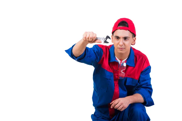 Young repairman with wrench spanner isolated on white — Stock Photo, Image